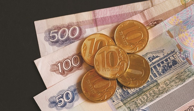 The rouble edged away from its weakest mark since late January yesterday in topsy-turvy trade, attempting to recover from its sharpest drop in nearly two years on Friday, and stocks dived as players ditched Russian assets on renewed fears of an imminent invasion of Ukraine