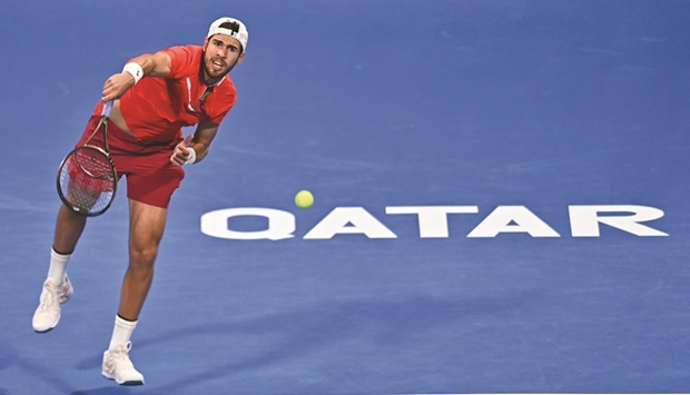 Karen Khachanov of Russia serves to Mackenzie McDonald of USA during their first round of the Qatar ExxonMobil Open at the Khalifa International Tennis Complex on Monday. PICTURE: Noushad Thekkayil