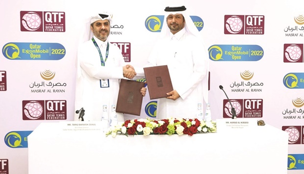 Group Chief Human Resources Officer of Masraf Al Rayan Hamad al-Kubaisi (right) and Secretary General of the QTSBF Tariq Zainal pose after signing the sponsorship agreement on Monday.