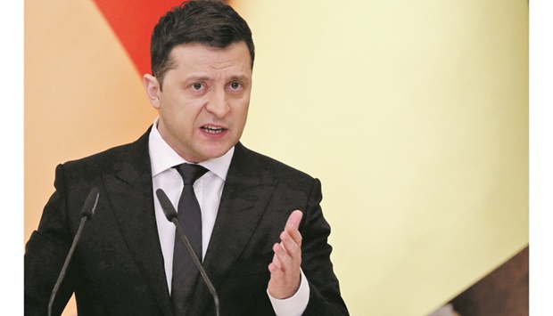 Ukrainian President Volodymyr Zelenskiy gestures during a joint news conference with German Chancellor Olaf Scholz in Kyiv yesterday. (Reuters)