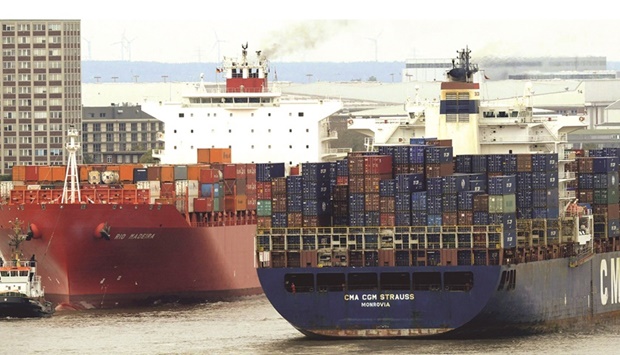 Containerships sail on the Elbe river as they leave and arrive at the harbour of Hamburg, Germany (file). Supply constraints lopped 2 percentage points off economic expansion in the eurozone in 2021, reducing manufacturing output by 6%.