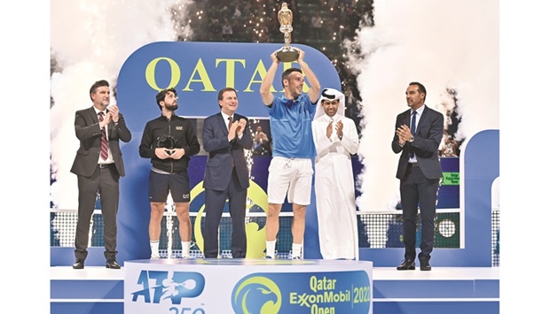 Roberto Bautista Agut of Spain lifts the Qatar ExxonMobil Open trophy after winning the final against Nikoloz Basillashvili of Georgia in Doha yesterday. The trophy was presented by Nasser al-Khelaifi, president of the Qatar Tennis Federation. PICTURES: Noushad Thekkayil