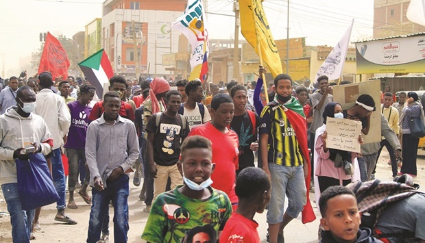Demonstrators march during ongoing protests calling for civilian rule and denouncing the military administration, in the Sahafa neighbourhood in the south of Sudanu2019s capital Khartoum, yesterday.