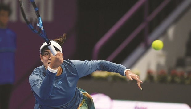 Garbine Muguruza of Spain in action against Sorana Cirsta of Romania during their their Qatar TotalEnergies Open match at Khalifa Tennis and Squash Complex in Doha.