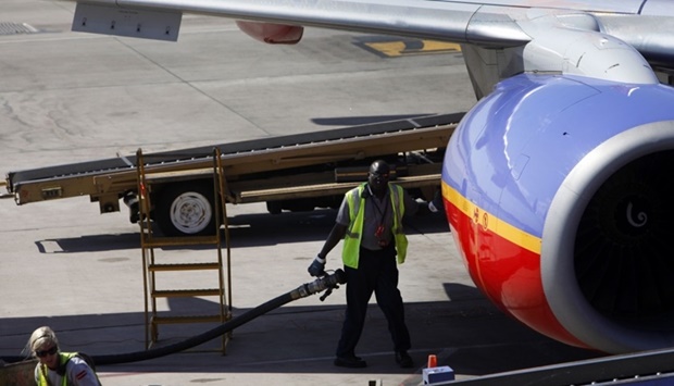 A worker prepared to refuel a Southwest Airlines plane sitting on the tarmac at Phoenix Sky Harbor International Airport. The rising price of jet fuel, which recently reached its highest point in well over five years, at almost $103/barrel, has become yet another challenge for the global aviation industry, which is badly hit because of Covid-19.