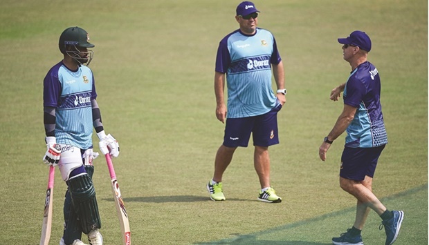 Bangladeshu2019s captain Tamim Iqbal (left) talks to batting coach Jamie Siddons (right) during a practice session ahead of their first one day international against Afghanistan at the Zahur Ahmed Chowdhury Stadium in Chittagong yesterday. (AFP)