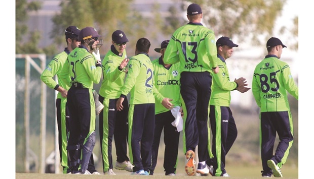 Ireland players celebrate after their comfortable 56-run victory over hosts Oman in World Cup qualifiers yesterday in Muscat.