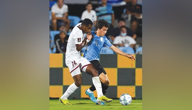 Venezuelau2019s Oscar Gonzalez and Uruguayu2019s Facundo Pellistri (right) vie for the ball during their South American qualification match for the FIFA World Cup Qatar 2022 at the Centenario Stadium in Montevideo on Tuesday (AFP)