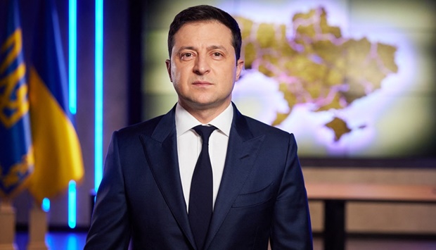 This handout picture taken and released on February 22, 2022 by Ukrainian Presidential press-service shows the President Volodymyr Zelensky looking on during his TV speech in Kyiv.