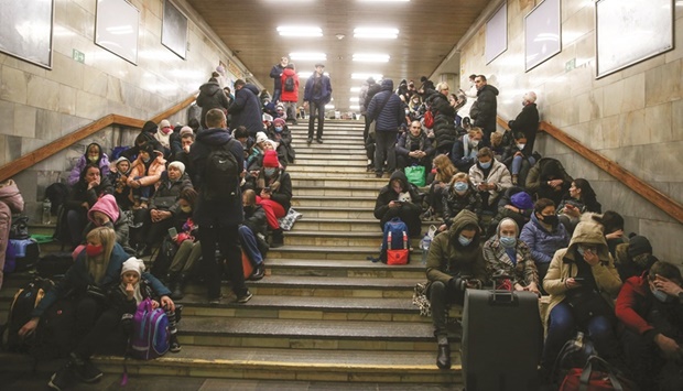 People take shelter in a subway station in Kyiv after Russian President Vladimir Putin authorised a military operation in eastern Ukraine.