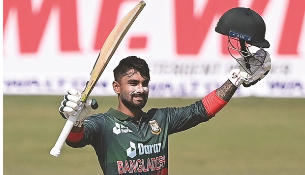 Bangladeshu2019s Liton Das celebrates after scoring a century during the second ODI against Afghanistan in Chittagong yesterday. (AFP)