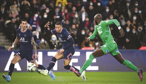 Paris Saint-Germainu2019s French forward Kylian Mbappe shoots to score the second goal for his team during the French L1 match against Saint-Etienne at The Parc des Princes Stadium in Paris. (AFP)