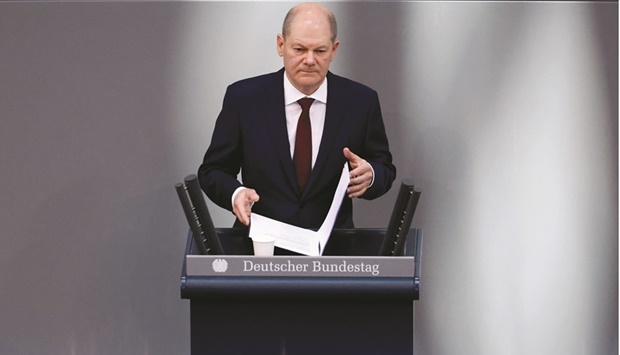 German Chancellor Olaf Scholz addresses an extraordinary session at the lower house of parliament Bundestag in Berlin Sunday after Russia launched a massive military operation against Ukraine. (Reuters)