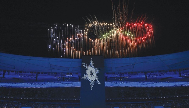 Fireworks in the shape of the Olympic rings explode over the National Stadium, known as the Birdu2019s Nest, during the opening ceremony. (AFP)