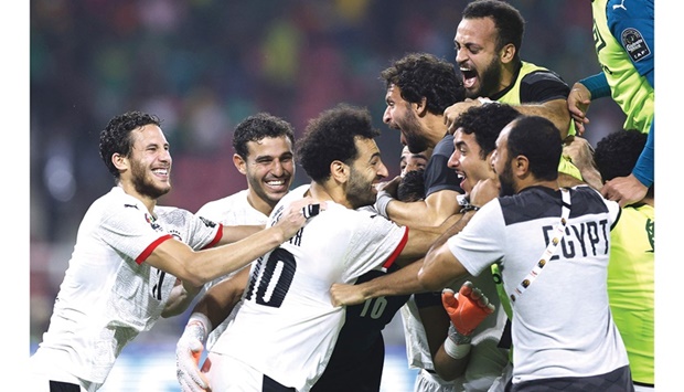 Egyptu2019s players celebrate after winning the Africa Cup of Nations semi-final against Cameroon in Yaounde on Thursday. (AFP)