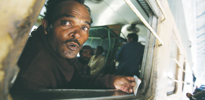 A fisherman from India looks out from a train window, after his release with others from a prison, at Karachiu2019s Cantonment railway station, yesterday.