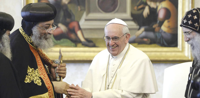 Pope Francis greets Tawadros II at the Vatican yesterday.