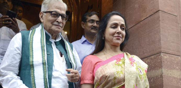 Ruling Bharatiya Janata Party MPs Murli Manohar Joshi and Hema Malini leave Parliament House at the end of the session yesterday.