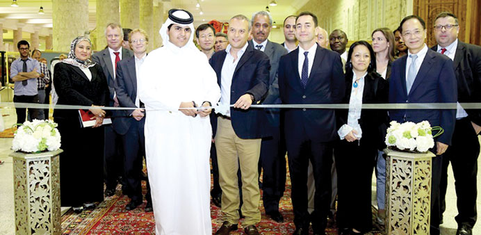 INAUGURATION: Sheikh Khaled bin Faisal al-Thani cuts the ribbon at the opening of the exhibition last week. 