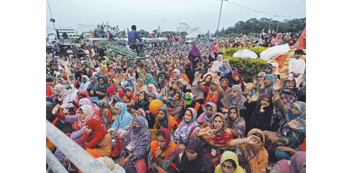 Supporters of Tahir ul-Qadri listen to his speech during a mass anti-government protest in Islamabad yesterday.
