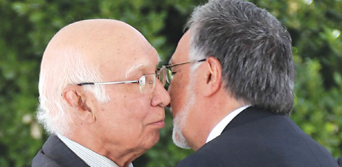 Foreign affairs adviser Sartaj Aziz is greeted by Afghan Foreign Minister Zalmai Rassoul in Kabul.