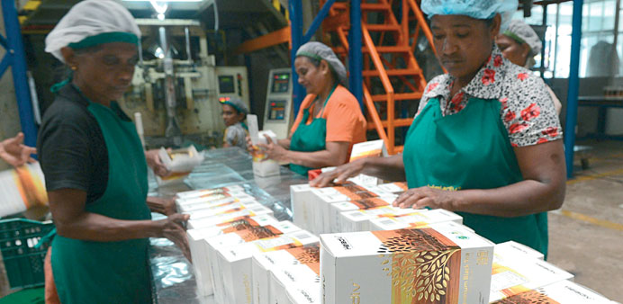Workers pack tea at a factory in Kandana on the outskirts of Colombo.