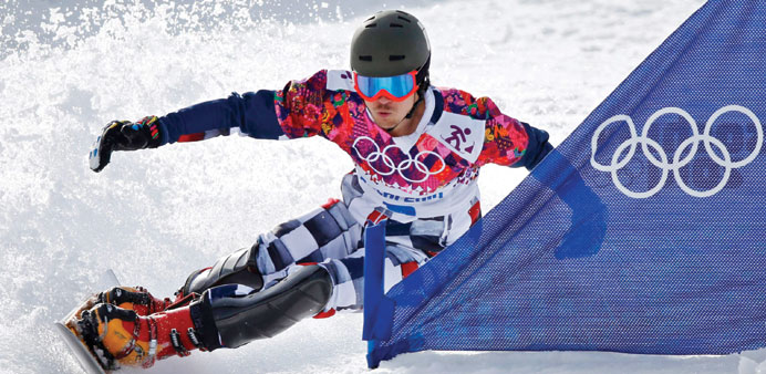 Russiau2019s Vic Wild competes during his gold medal run during the menu2019s snowboard parallel slalom final in Rosa Khutor yesterday. (Reuters)