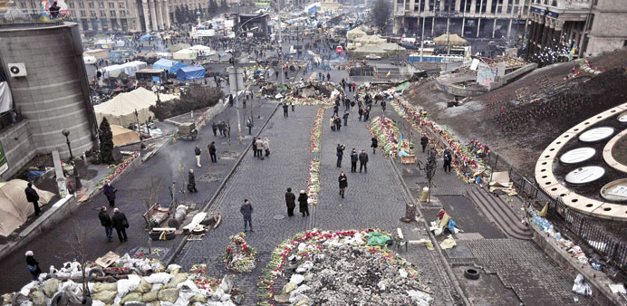 People walk on Kievu2019s Independence square. Ukraine is seeking to find a way out of its most serious crisis since independence. 