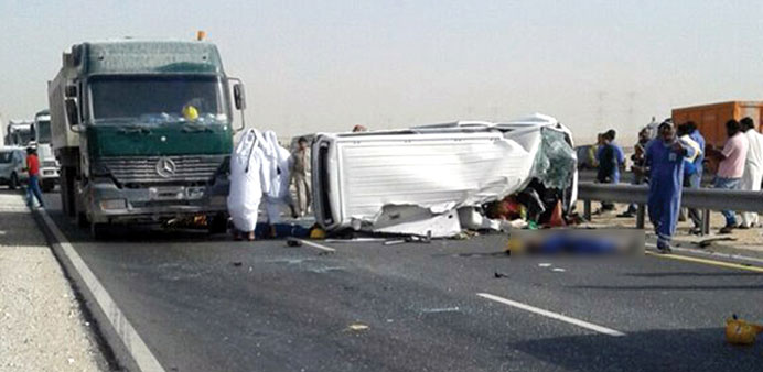 The van lying across the road. The truck involved in the accident can also be seen. PICTURE: Irfaan Raskin