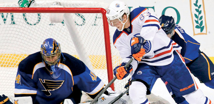 St Louis Blues goalie Jaroslav Halak makes a save against Edmonton Oilersu2019 Ales Hemsky during the third period of their NHL hockey game in St Louis, M
