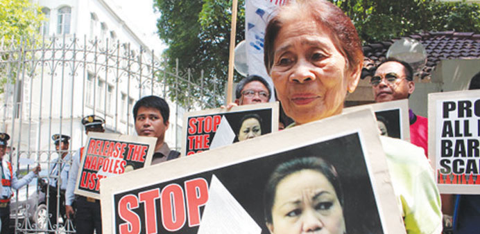Members of militant groups hold a rally in front of the Department of Justice building in Manila, calling for release of the affidavit signed by Janet