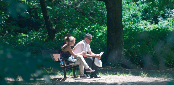 A couple enjoy the sunshine in Hampstead Heath in north London yesterday.