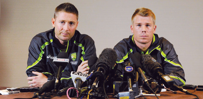 Australian captain Michael Clarke (left) and opener David Warner speak to reporters in London after the brawl during which Warner punched England's Jo