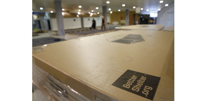  Packages of disassembled migrant shelters are seen inside an exhibition hall in Zurich.
