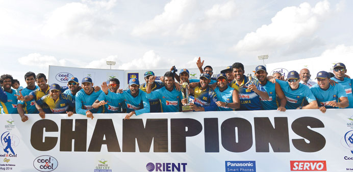 Sri Lankan team celebrate their ODI series victory over Pakistan after they won the final match in Dambulla, yesterday. (AFP) 