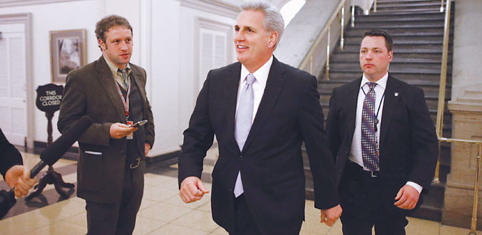 Majority Whip Kevin McCarthy heads to a House Republican Caucus meeting where members considered the legislation that is supposed to blunt the effects