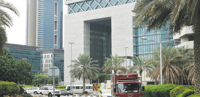 A truck and taxi drive past the Dubai International Financial Centre (file). The UAE is the only one in the six-nation Gulf Co-operation Council that 