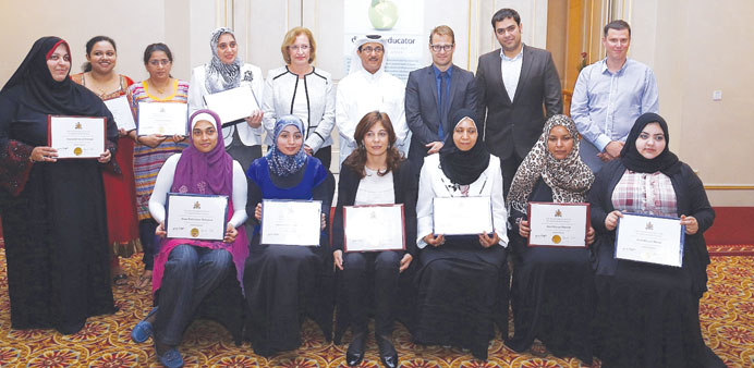 The diabetes nurses display their certificates as they pose with Dr al-Hamaq.
