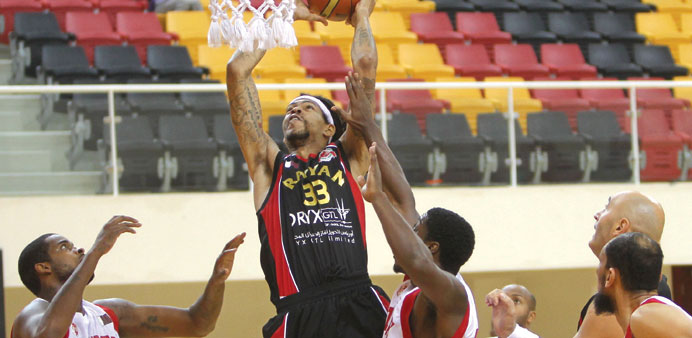 Al Rayyanu2019s Jermareo Davidson goes for the basket against Al Shamal yesterday.
