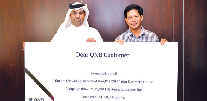 The first winners of QNBu2019s u201cYour Summer Is On Usu201d promotion receive reward points.