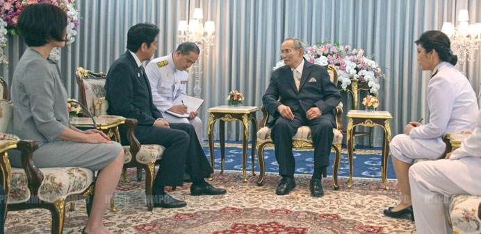 Thailandu2019s King Bhumibol Adulyadej with Japanu2019s Prime Minister Shinzo Abe and his wife during a meeting at Siriraj Hospital in Bangkok yesterday.