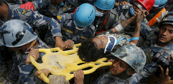 Earthquake survivor Pema Lama, 15, is rescued by the Armed Police Force