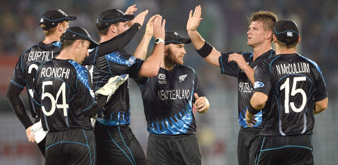 New Zealandu2019s  Corey Anderson (second right) celebrates with teammates after dismissing Englandu2019s Moeen Ali in Chittagong. (AFP)