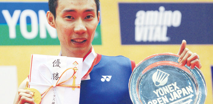 Lee Chong Wei shows off his gold medal and victory plate after winning the Japan Open final yesterday. (AFP)