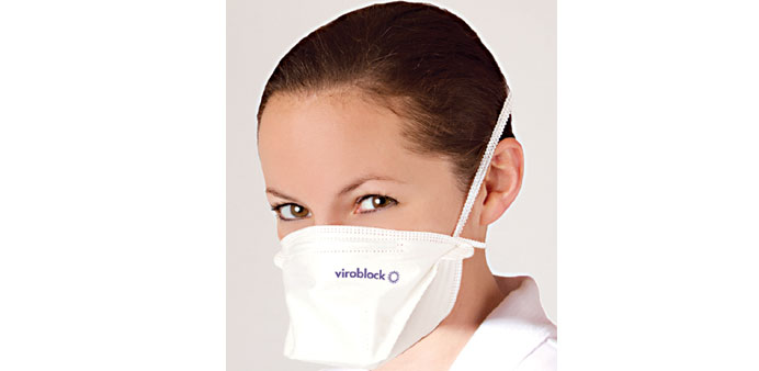 A model wears the new face mask that traps flu viruses.