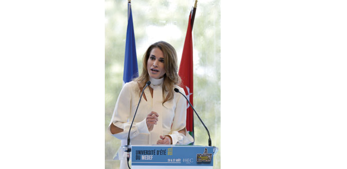  Queen Rania delivers a speech yesterday in Jouy-en-Josas, near Paris. 