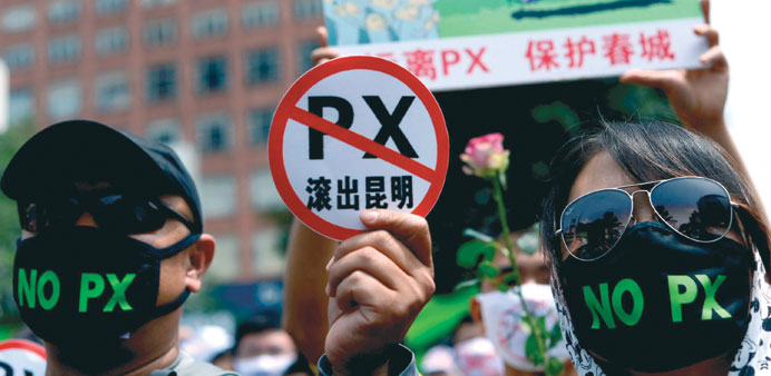   Demonstrators display banners during a protest against plans for a factory which will produce paraxylene in Kunming, southwest Chinau2019s Yunnan provin