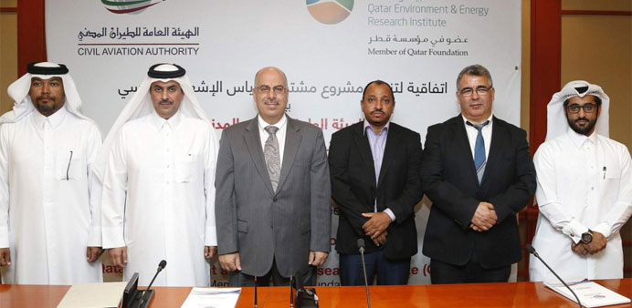 Qatar Environment and Energy Research Institute and Civil Aviation Authority officials at the signing ceremony of Qatar Solar Map project. PICTURE: Ja