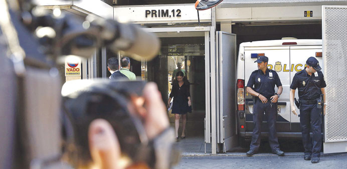 A camera man films police officers at the entrance of the National Courts where parents of Ashya King testified yesterday before Spanish judge Ismael 
