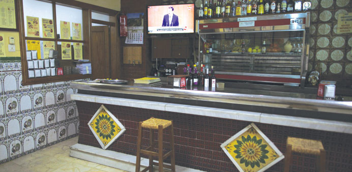 Rajoy is seen on a television screen at an empty bar in downtown Ronda, near Malaga, southern Spain.